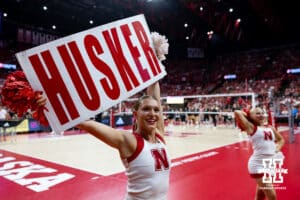 Nebraska Cornhusker cheer squat lead the fans in Husker Power before a college volleyball match against the Grand Canyon Lopes on Saturday, September 13, 2025, in Lincoln, Nebraska. Photo by John S. Peterson.