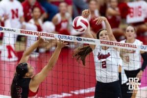 Nebraska Cornhusker Bergen Reilly (2) dumps the ball against Utah Ute Emrie Moea'i (2) in the third set during a college volleyball match on Friday, September 12, 2025, in Lincoln, NE. Photo by John S. Peterson.