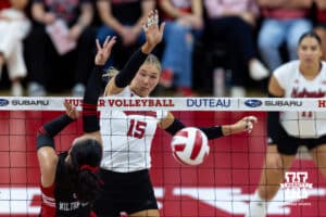 Nebraska Cornhusker Andi Jackson (15) spikes the ball against Utah Ute Leah Wilton-LaBoy (5) in the third set during a college volleyball match on Friday, September 12, 2025, in Lincoln, NE. Photo by John S. Peterson.