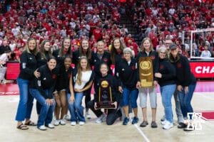 The Nebraska championship teams from 1995 and 2015 pose for a photo during a college volleyball match on Friday, September 12, 2025, in Lincoln, NE. Photo by John S. Peterson.