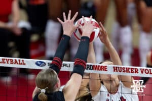 Nebraska Cornhusker Bergen Reilly (2) battles Utah Ute Katelynn Field (12) at the net in the second set during a college volleyball match on Friday, September 12, 2025, in Lincoln, NE. Photo by John S. Peterson.