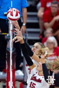 Nebraska Cornhusker Allie Sczech (3) and Nebraska Cornhusker Andi Jackson (15) reach fo the ball against the Utah Utes in the first set during a college volleyball match on Friday, September 12, 2025, in Lincoln, NE. Photo by John S. Peterson.