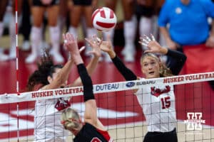 Nebraska Cornhuskers Virginia Adriano (9) and Andi Jackson (15) block the ball against the Utah Utes in the first set during a college volleyball match on Friday, September 12, 2025, in Lincoln, NE. Photo by John S. Peterson.