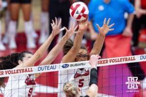 Nebraska Cornhuskers Virginia Adriano (9) and Rebekah Allick (5) block the ball against the Utah Utes in the first set during a college volleyball match on Friday, September 12, 2025, in Lincoln, NE. Photo by John S. Peterson.