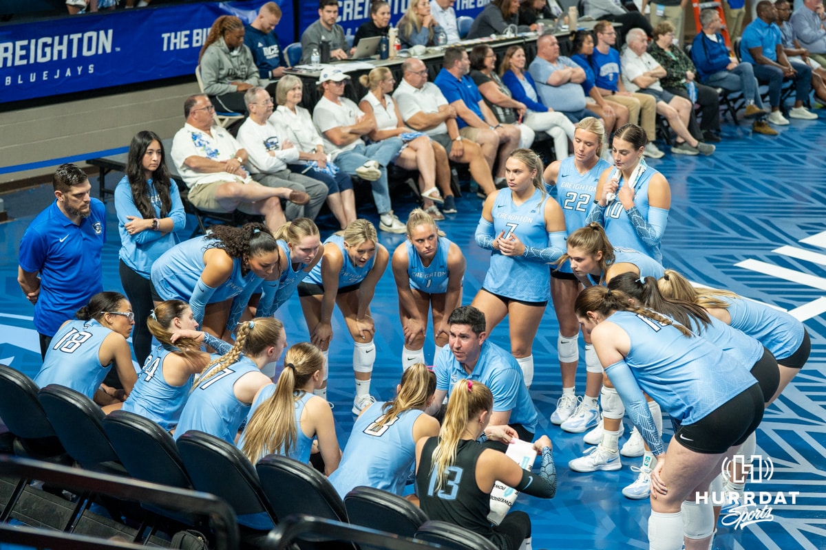 The Creighton Bluejays huddle up during a timeout during a volleyball match against Louisville on Friday, September 12th, 2025 in Omaha, Nebraska. Photo by Brandon Tiedemann.