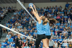 Creighton Bluejays Kiara Reinhardt (5) blocks an opposing hit during a volleyball match against Louisville on Friday, September 12th, 2025 in Omaha, Nebraska. Photo by Brandon Tiedemann.