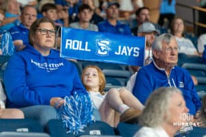 A young fan holds up a Roll Jays sign during a volleyball match against Louisville on Friday, September 12th, 2025 in Omaha, Nebraska. Photo by Brandon Tiedemann.