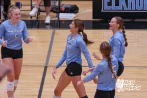 Reagan Wallraff smiles with her team during the Elkhorn North Volleyball game vs Gretna on September 2nd, 2025 in Omaha, Nebraska. Photo by Drew Balus