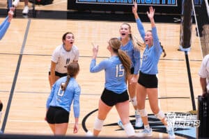 Emma Nadgwick, Kaitlyn Huff, and Reese Wallraff celebrate during the Elkhorn North Volleyball game vs Gretna on September 2nd, 2025 in Omaha, Nebraska. Photo by Drew Balus