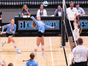 Payton Palmer jumps high to spike the ball during the Elkhorn North Volleyball game vs Gretna on September 2nd, 2025 in Omaha, Nebraska. Photo by Drew Balus