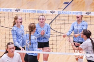 The players smile after the scored point during the Elkhorn North Volleyball game vs Gretna on September 2nd, 2025 in Omaha, Nebraska. Photo by Drew Balus