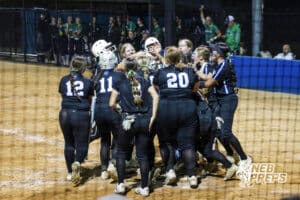 Marian surrounds their homerun hitter during the Skutt vs Marian Softball game on September 4th, 2025 in Omaha, Nebraska. Photo by Drew Balus