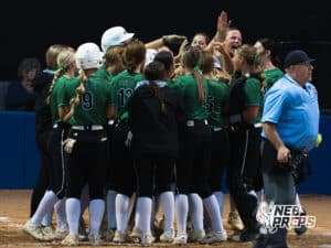 The Skutt team surround the batter after a grand slam during the Skutt vs Marian Softball game on September 4th, 2025 in Omaha, Nebraska. Photo by Drew Balus