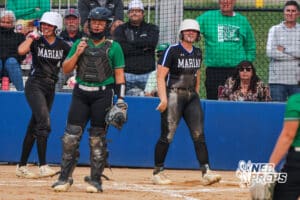 Aubrey Mueting smiles, covered in dirt, during the Skutt vs Marian Softball game on September 4th, 2025 in Omaha, Nebraska. Photo by Drew Balus