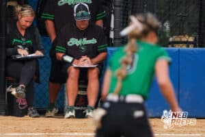 Head Coach, Ryan Glatter, checks his lineup during the Skutt vs Marian Softball game on September 4th, 2025 in Omaha, Nebraska. Photo by Drew Balus
