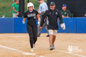 Adele Tompsett smiles with her coach during the Skutt vs Marian Softball game on September 4th, 2025 in Omaha, Nebraska. Photo by Drew Balus