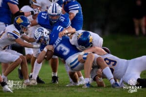 Ashland-Greenwood quarterback Derek Tonjes (3) falls to the grround after being tackled by Wahoo defenders during a high school football game, Friday, September 5th, 2025, Ashland, Nebraska. Photo by Braden Cochran.