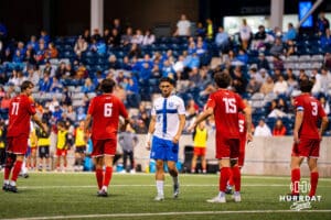 Bautista Rossi walks through a crowd of Denver players. Creighton men's hosted Denver at Morrison Stadium in Omaha, Nebraska for Socctoberfest on September 5th, 2025. Photo by Kyle Byers.