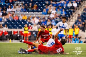 Ali Ramadan collides with two Denver players. Creighton men's hosted Denver at Morrison Stadium in Omaha, Nebraska for Socctoberfest on September 5th, 2025. Photo by Kyle Byers.