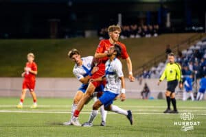 Two Creighton players collide with a Denver player. Creighton men's hosted Denver at Morrison Stadium in Omaha, Nebraska for Socctoberfest on September 5th, 2025. Photo by Kyle Byers.