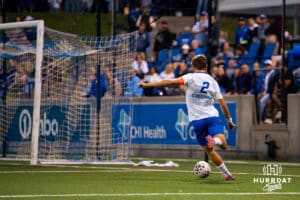 Matthew Reed crosses the ball. Creighton men's hosted Denver at Morrison Stadium in Omaha, Nebraska for Socctoberfest on September 5th, 2025. Photo by Kyle Byers.