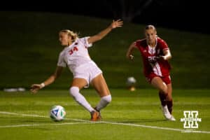 Nebraska's Ella Rudney (25) runs for the ball around falling Oregon State defender Abbi Leonard (34) during a college soccer game, Thursday, September 4th, 2025, Lincoln, Nebraska. Photo by Braden Cochran.