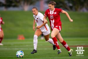Nebraska defender Lauryn Anglim (21) moves the ball upfield past an Oregon State player during a college soccer game, Thursday, September 4th, 2025, Lincoln, Nebraska. Photo by Braden Cochran.
