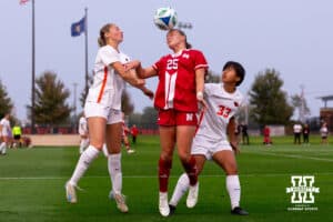 Nebraska Midfielder Ella Rudney reaches for a header contested by two Oregon State opposing players during a college soccer game, Thursday, September 4th, 2025, Lincoln, Nebraska. Photo by Braden Cochran.