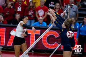 Nebraska Cornhusker Teraya Sigler (11) spikes the ball for match poiint against the California Golden Bears in the third set during a college volleyball match on Sunday, September 7, 2025 in Lincoln, NE. Photo by John S. Peterson.