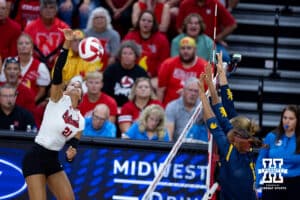 Nebraska Cornhusker Skyler Pierce (21) spikes the ball against the California Golden Bears in the third set during a college volleyball match on Sunday, September 7, 2025 in Lincoln, NE. Photo by John S. Peterson.