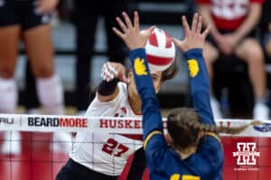 Nebraska Cornhusker Harper Murray (27) spikes the ball against California Golden Bear Arissa Carbonara (17)in the second set during a college volleyball match on Sunday, September 7, 2025 in Lincoln, NE. Photo by John S. Peterson.