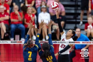 Nebraska Cornhusker Harper Murray (27) tips the ball over California Golden Bear Mikayla Hayden (7) and California Golden Bear Dominique Phills (10) in the second set during a college volleyball match on Sunday, September 7, 2025 in Lincoln, NE. Photo by John S. Peterson.