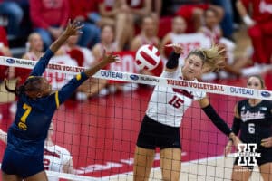 Nebraska Cornhusker Andi Jackson (15) spikes the ball against California Golden Bear Mikayla Hayden (7) in the first set during a college volleyball match on Sunday, September 7, 2025 in Lincoln, NE. Photo by John S. Peterson.