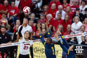 Nebraska Cornhusker Harper Murray (27)spikes the ball against California Golden Bears Mikayla Hayden (7) and Grace Agolli (11) in the first set during a college volleyball match on Sunday, September 7, 2025 in Lincoln, NE. Photo by John S. Peterson.