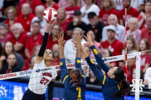 Nebraska Cornhusker Harper Murray (27) spikes the ball against California Golden Bears Mikayla Hayden (7) and Grace Agolli (11) in the first set during a college volleyball match on Sunday, September 7, 2025 in Lincoln, NE. Photo by John S. Peterson.