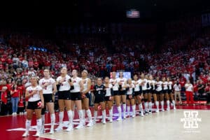 Nebraska Cornhuskers lined up fo the National Anthem before the match against the California Golden Bears during a college volleyball match on Sunday, September 7, 2025 in Lincoln, NE. Photo by John S. Peterson.