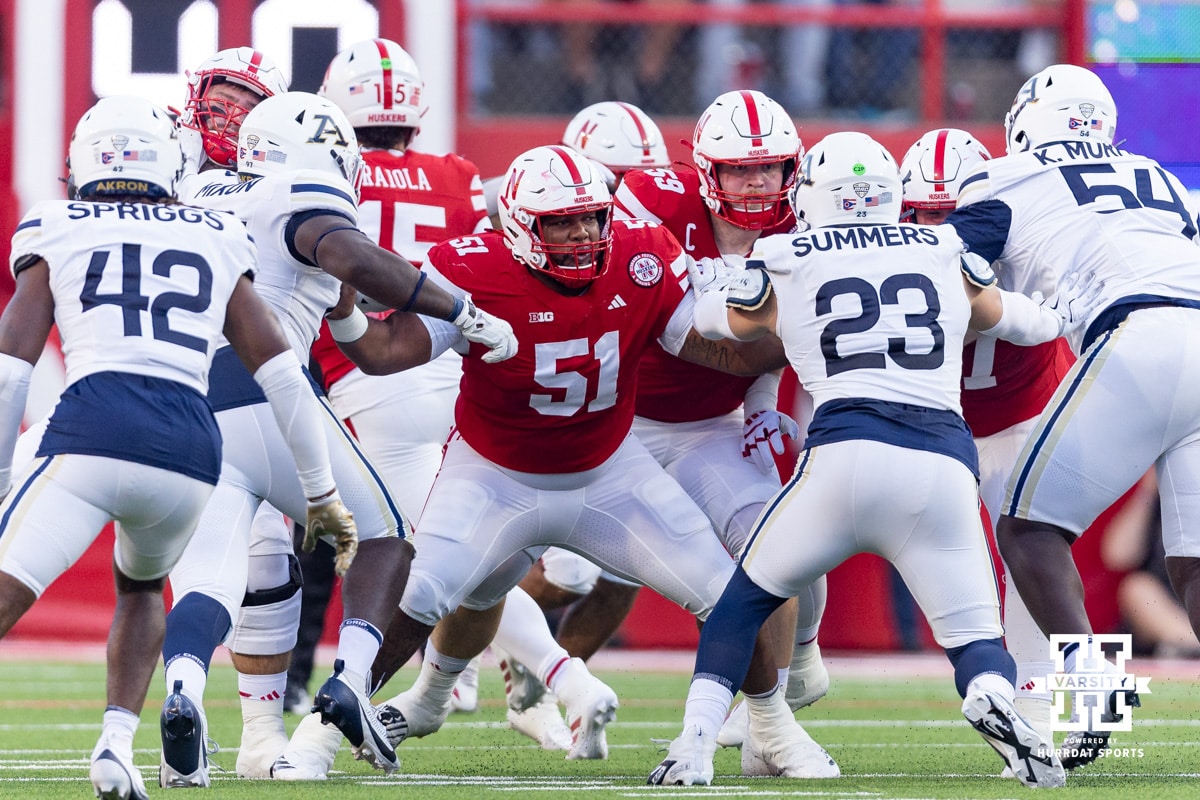 Nebraska Cornhusker Justin Evans (51) blocks Akron Zips Gage Summers (23) and Jon' Trell Mixon during a college football game on Saturday, September 6, 2025 in Lincoln, NE. Photo by John S. Peterson.