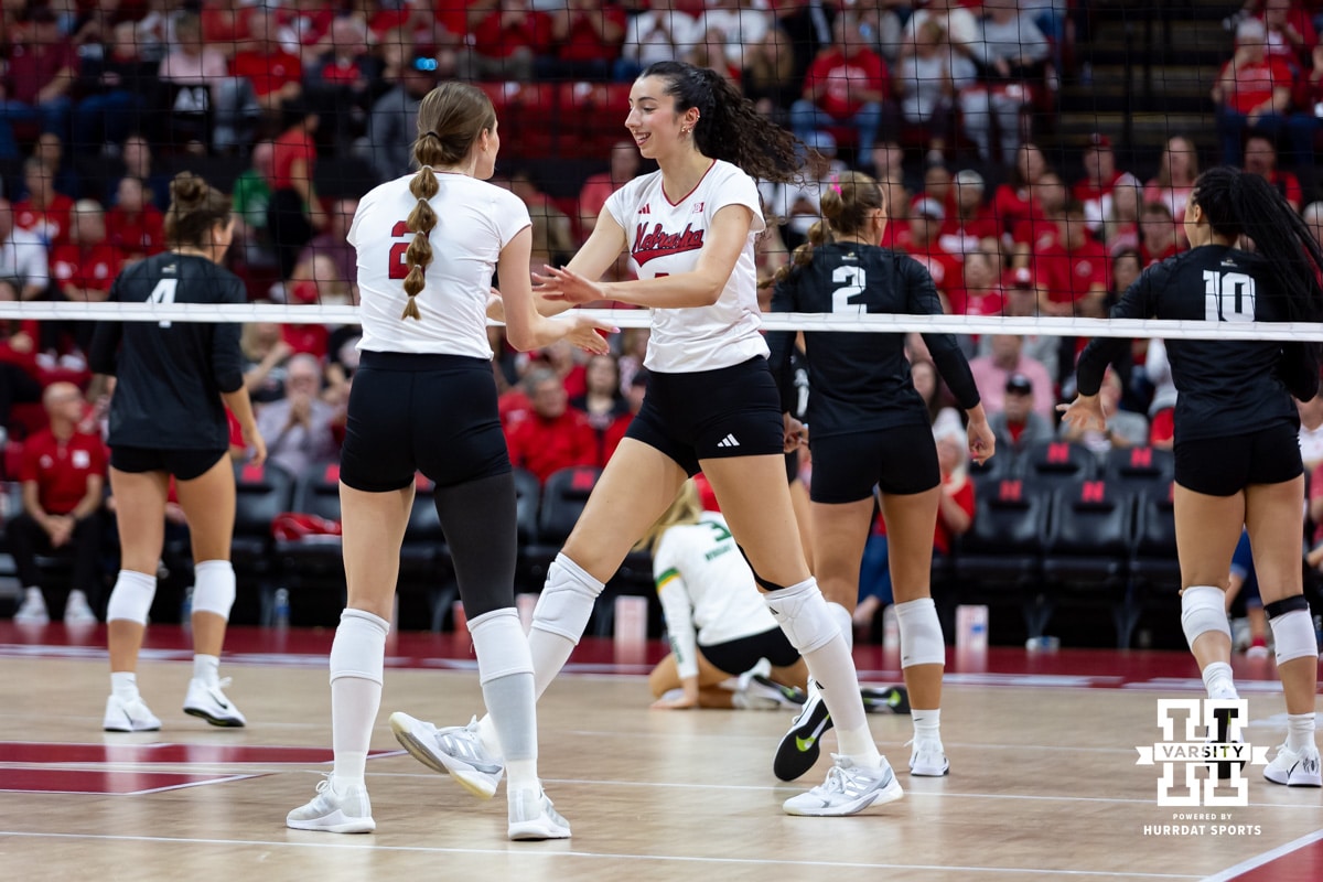 Nebraska Cornhusker Virginia Adriano (9) gives five to Bergen Reilly (2) against the Wright State Raiders in the third set during a college volleyball match on Friday, September 5, 2025 in Lincoln, NE. Photo by John S. Peterson.