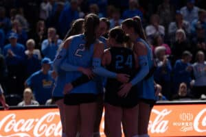 Creighton Bluejays celebrate winning the second set during a volleyball match against DePaul on Friday, October 31, 2025, in Omaha, Nebraska. Photo by Brandon Tiedemann.