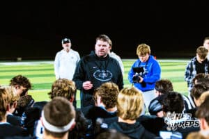 Elkhorn Norths Head Coach Sam Stanley is emotional while giving his team a post game speech after winning a high school football game against Bennington on Thursday, October 23, 2025 in Omaha, Nebraska. Photo By Jack Stephens.