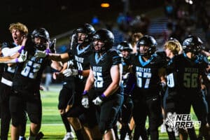 Elkhorn North is celebrating as a team after huge touchdown to win the game in the last second after a high school football game against Bennington on Thursday, October 23, 2025 in Omaha, Nebraska. Photo By Jack Stephens.
