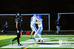 Benningtons Knox Naughton (21) and Lane Molacek (25) is celebrating after scoring touchdown during a high school football game against at Elkhorn North on Thursday, October 23, 2025 in Omaha, Nebraska. Photo By Jack Stephens.