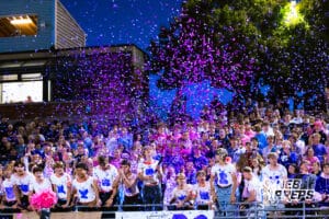 Elkhorn Norths Student Section honoring head coach Sam Stanley's son who passed away with purple confetti at the start of a high school football game against Bennington on Thursday, October 23, 2025 in Omaha, Nebraska. Photo By Jack Stephens.