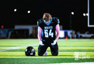 Elkhorn Norths Parker Christoffels (64) is praying before a high school football game against Bennington on Thursday, October 23, 2025 in Omaha, Nebraska. Photo By Jack Stephens.