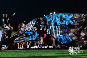 Elkhorn North running out as a team with Ethan Beachy (5) leading the pack before a high school football game against Bennington on Thursday, October 23, 2025 in Omaha, Nebraska. Photo By Jack Stephens.