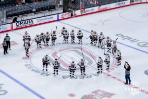 Omaha Mavericks huddle up at the end of a hockey match against the UMass Minutemen at Baxter Arena on October 24th, 2025, in Omaha, Nebraska. Photo by Collin Stilen.