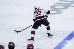 Omaha Maverick Aidan de La Gorgendiere looks to pass against the UMass Minutemen during a hockey match at Baxter Arena on October 24th, 2025, in Omaha, Nebraska. Photo by Collin Stilen.