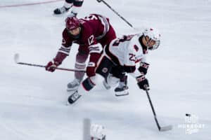 Omaha Maverick Maxime Pellerin gets caught up against the UMass Minutemen during a hockey match at Baxter Arena on October 24th, 2025, in Omaha, Nebraska. Photo by Collin Stilen.