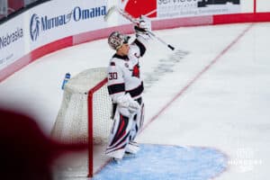 Omaha Maverick Simon Latkoczy in the goal against the UMass Minutemen during a hockey match at Baxter Arena on October 24th, 2025, in Omaha, Nebraska. Photo by Collin Stilen.