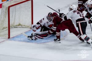 Omaha Maverick Simon Latkoczy makes a save during a hockey match at Baxter Arena against the UMass Minutemen on October 24th, 2025, in Omaha, Nebraska. Photo by Collin Stilen.